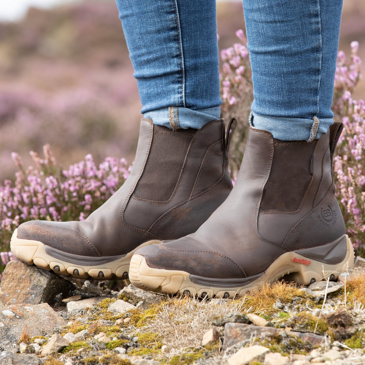 Brown waterproof short boots worn outdoors for cold-weather yard work