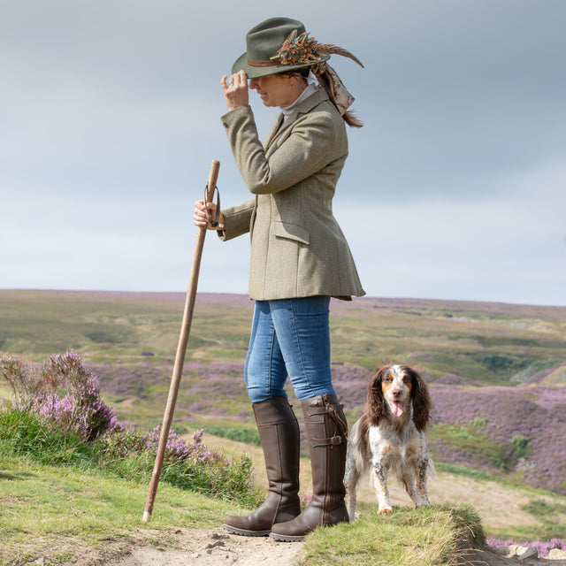 Waterproof country boots worn on a countryside walk
