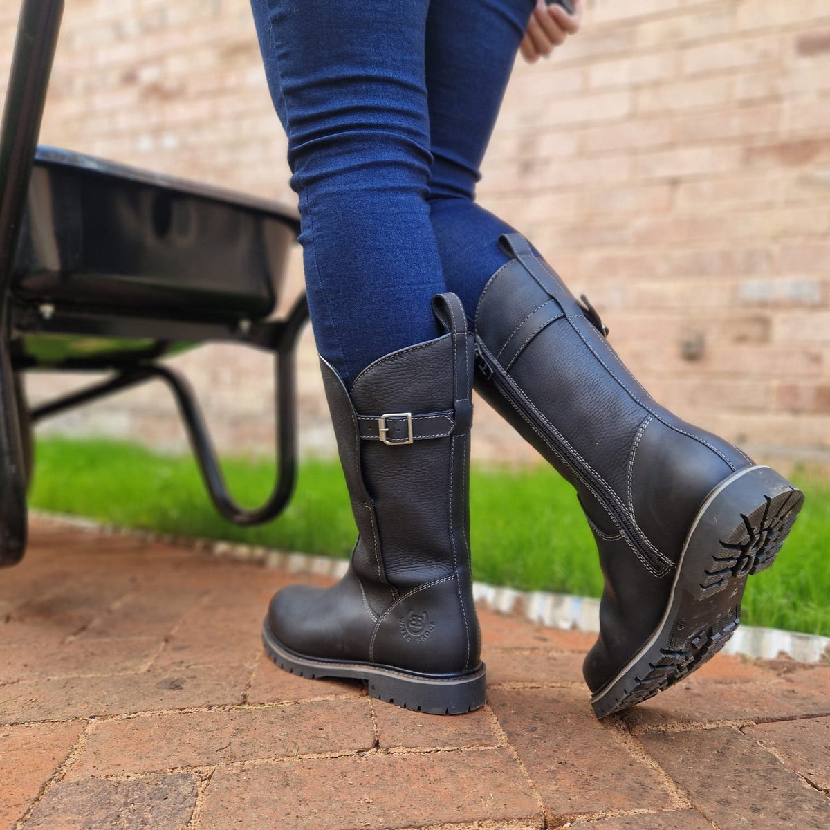 Black Quebec waterproof zip-up mid-calf boots showing the side zip