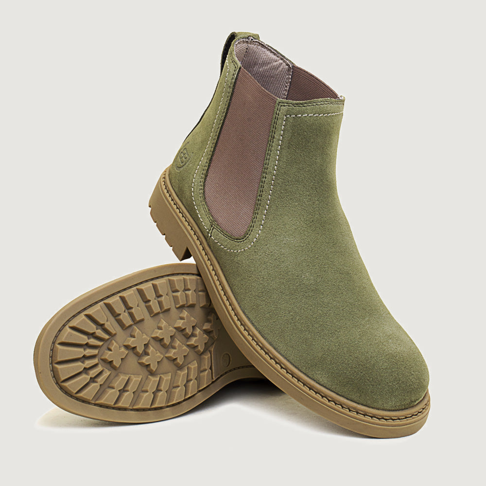 Bareback Toddy suede Chelsea boots in sage green, angled view showing the outsole