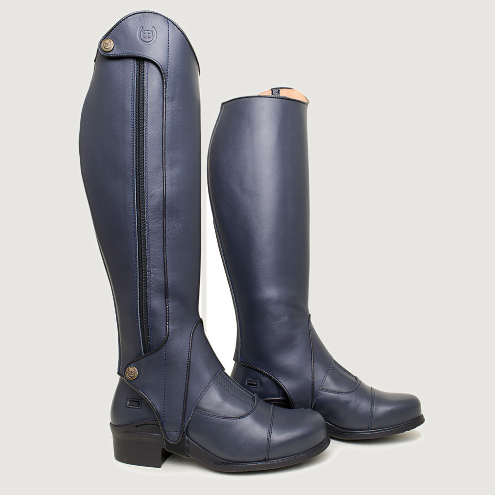 Bareback Vaqueros premium half-chaps in navy leather, rear three-quarter view showing the zip