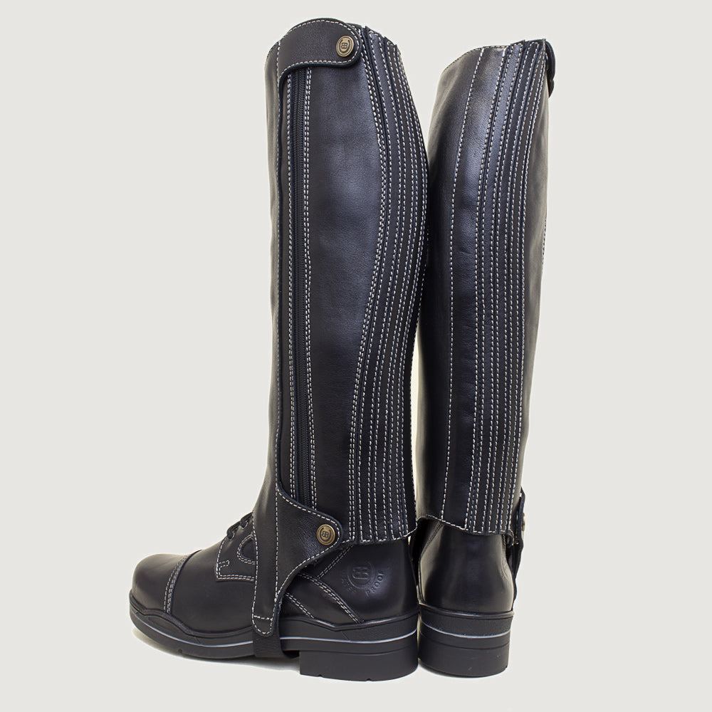 Bareback Kentucky half-chaps in polished black leather, rear three-quarter view showing the zip
