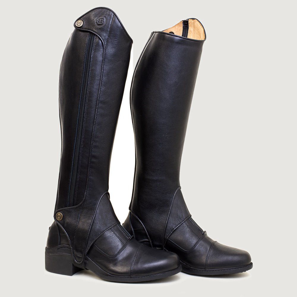 Bareback Vaqueros premium half-chaps in black leather, front view worn over riding boots