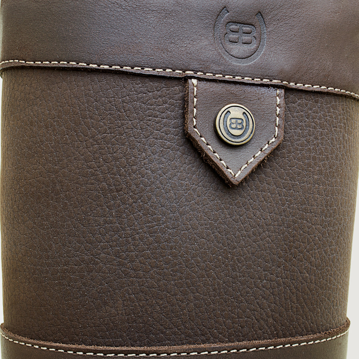 Bareback Dakota waterproof country boots in brown leather, close-up of the pull strap and branded stud detail