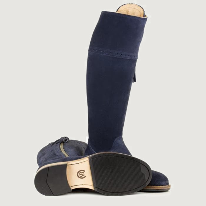 Bareback Sovereign suede tassel boots in blue, showing the leather sole and heel