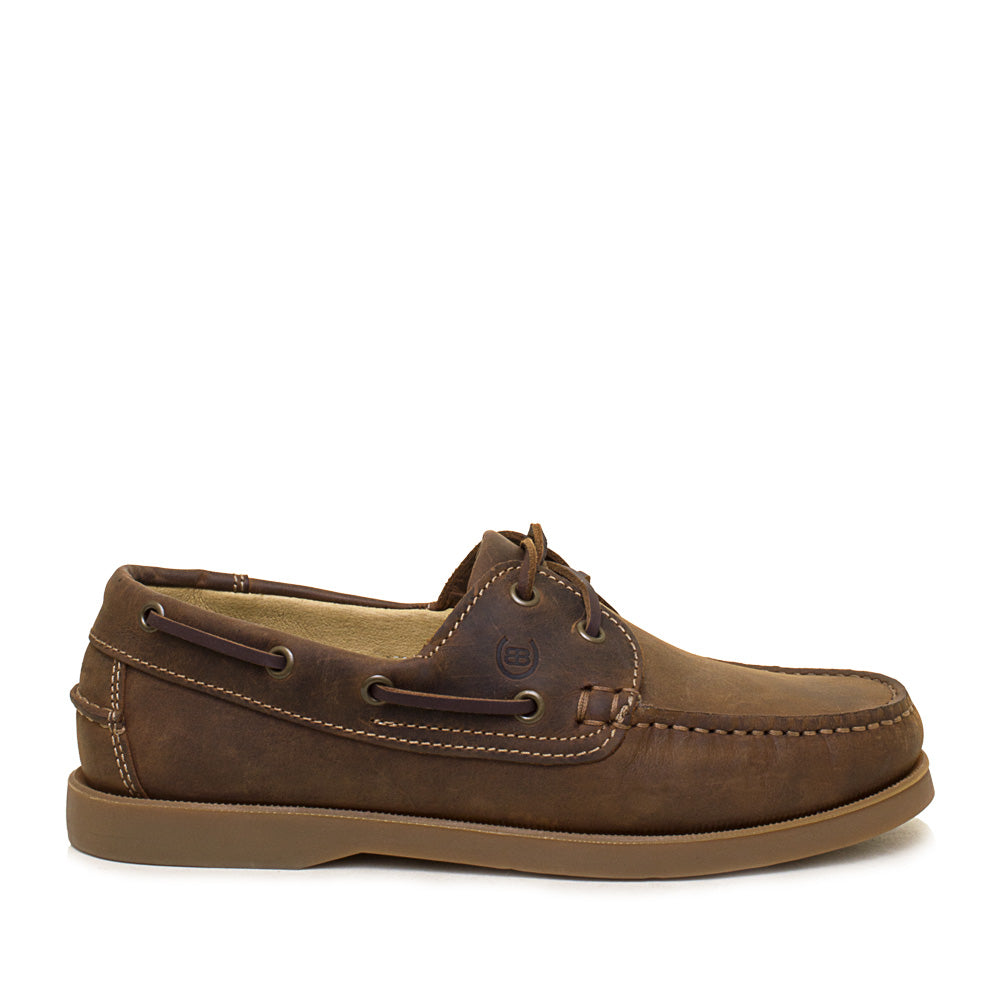 Brown leather boat shoe on a white background