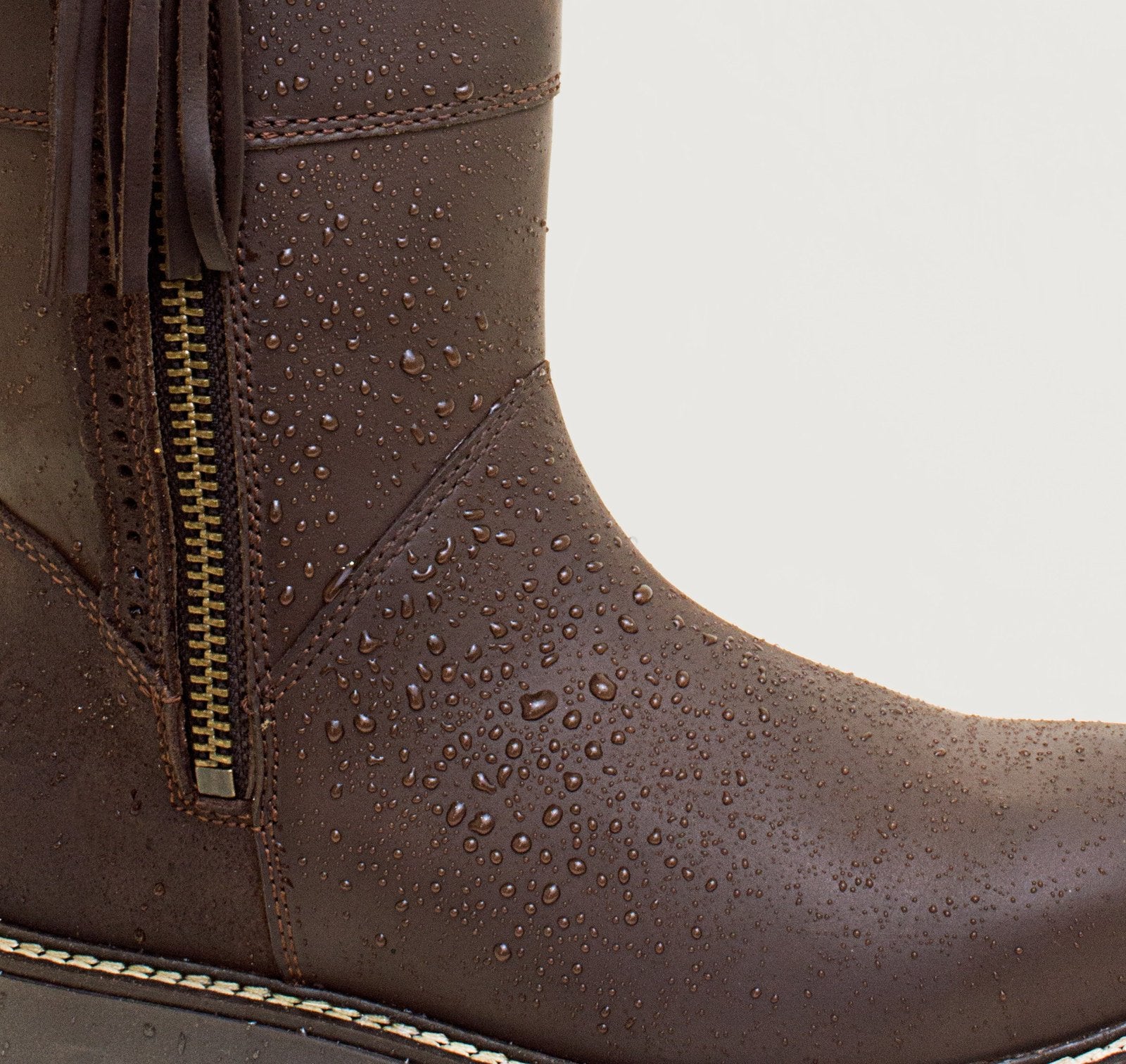 Bareback Hudson Mid waterproof boots in chocolate leather, close-up showing water beading on the leather
