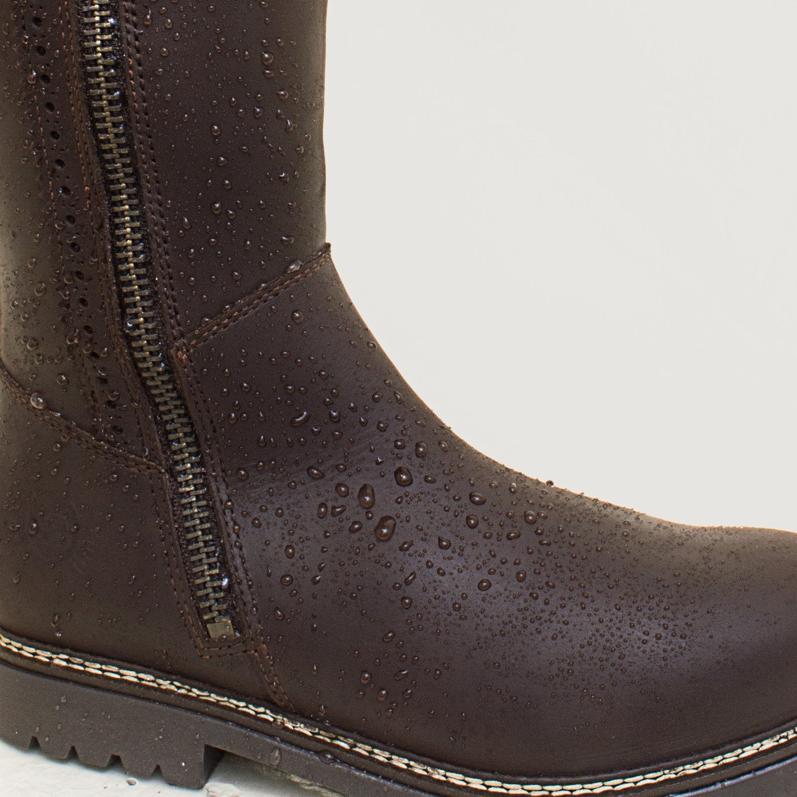 Bareback Hudson Storm waterproof boots in chocolate leather, close-up showing water beading on the leather