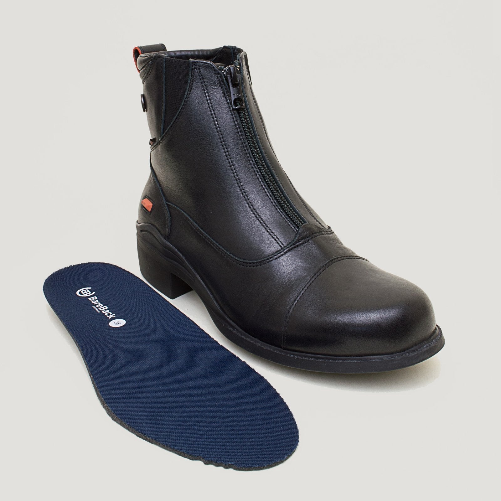 Bareback Idaho Storm waterproof jodhpur riding boots in black leather, with the insole placed beside the boot