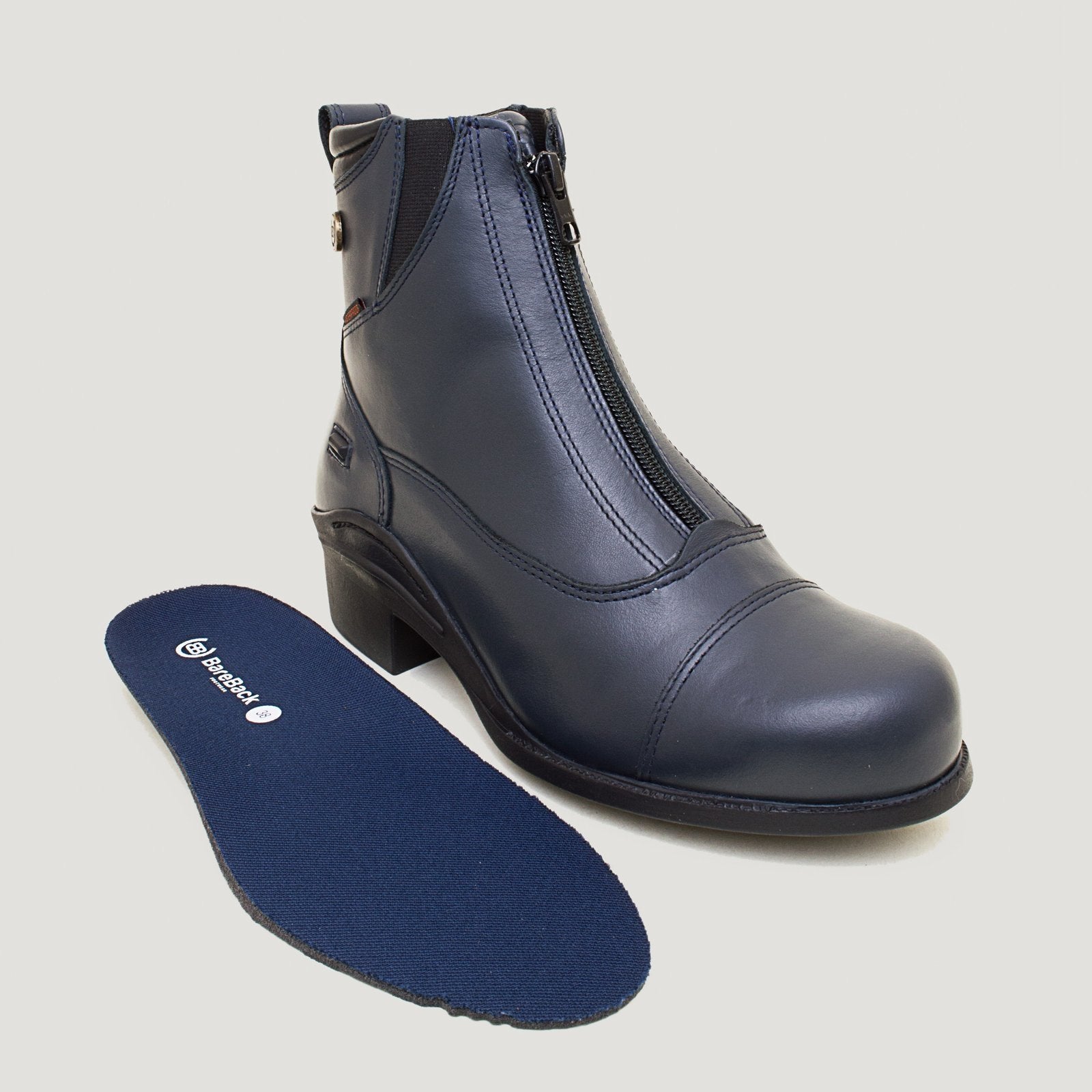 Bareback Idaho Storm waterproof jodhpur riding boots in navy leather, with the insole placed beside the boot