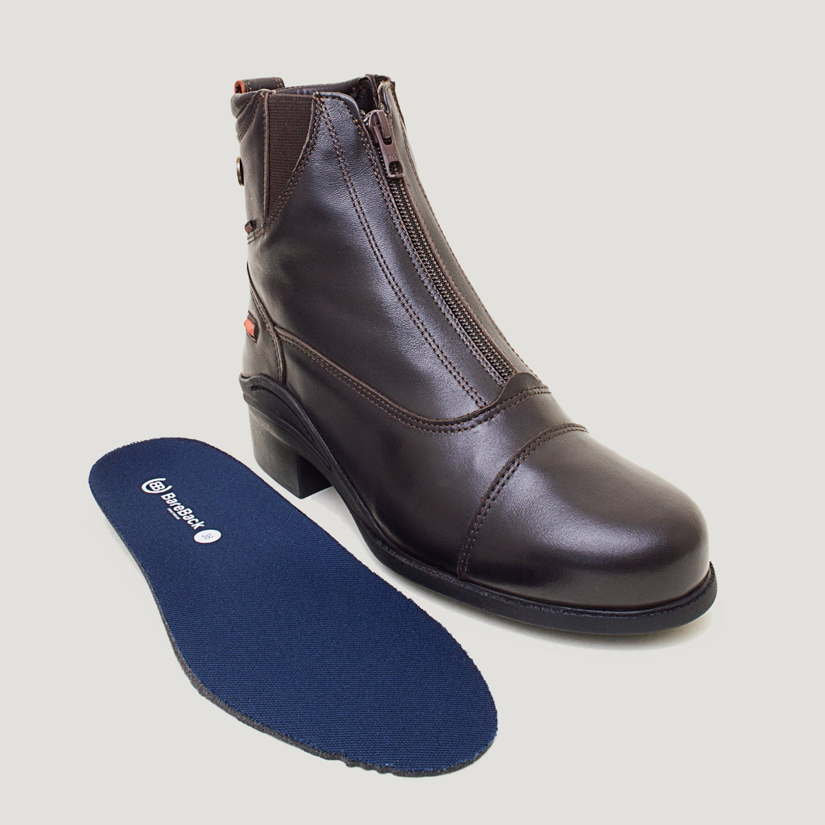 Bareback Idaho Storm waterproof jodhpur riding boots in brown leather, with the insole placed beside the boot