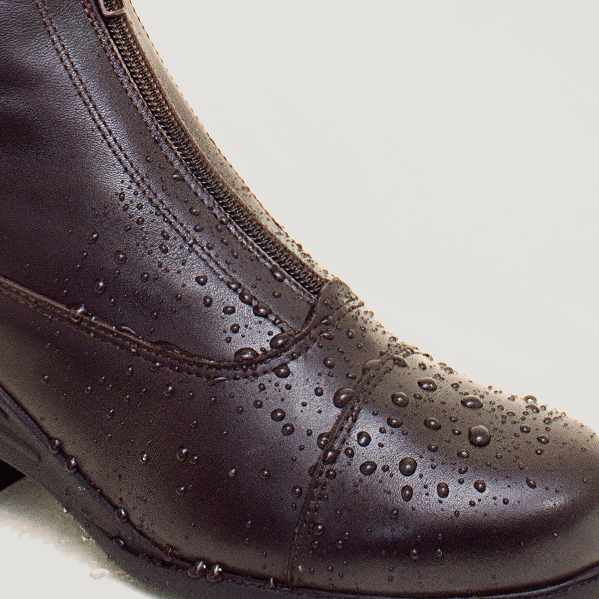 Bareback Idaho Storm waterproof jodhpur riding boots in brown leather, close-up showing water beading on the leather