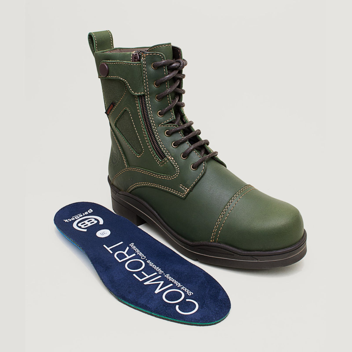 Bareback Kentucky Storm waterproof jodhpur boots in forest green, standing beside the removable Comfort insole