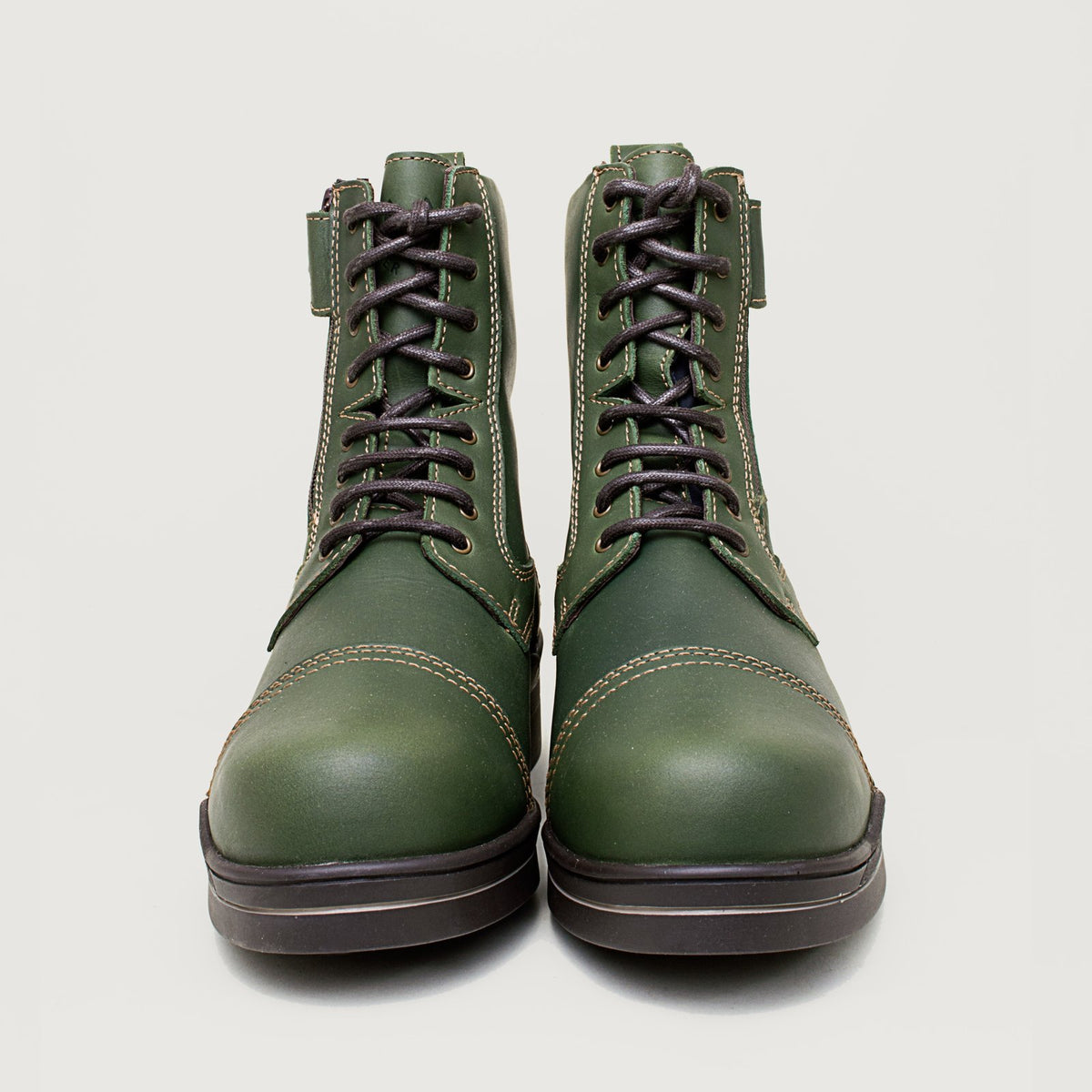 Bareback Kentucky Storm waterproof jodhpur boots in forest green, front view of the pair with the laces fastened