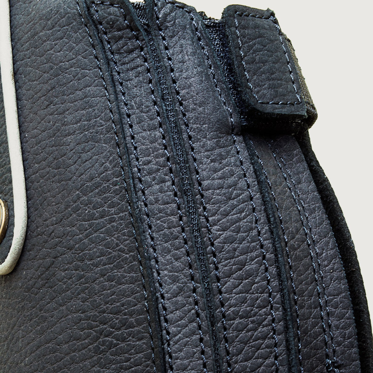 Close-up of the elastic calf panel and rear zip on a Montana black riding boot