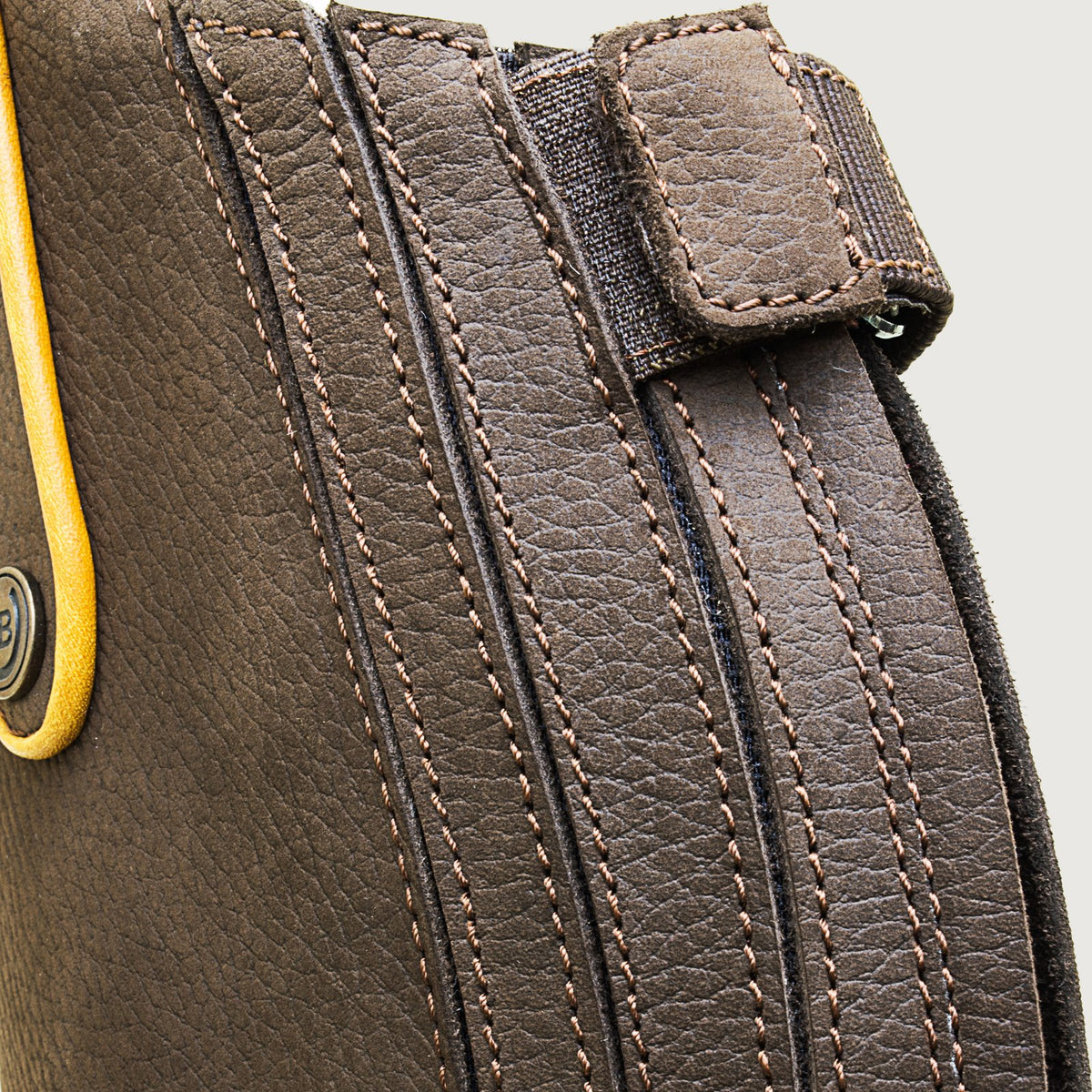 Close-up of the elastic calf panel and rear zip on a Montana brown riding boot