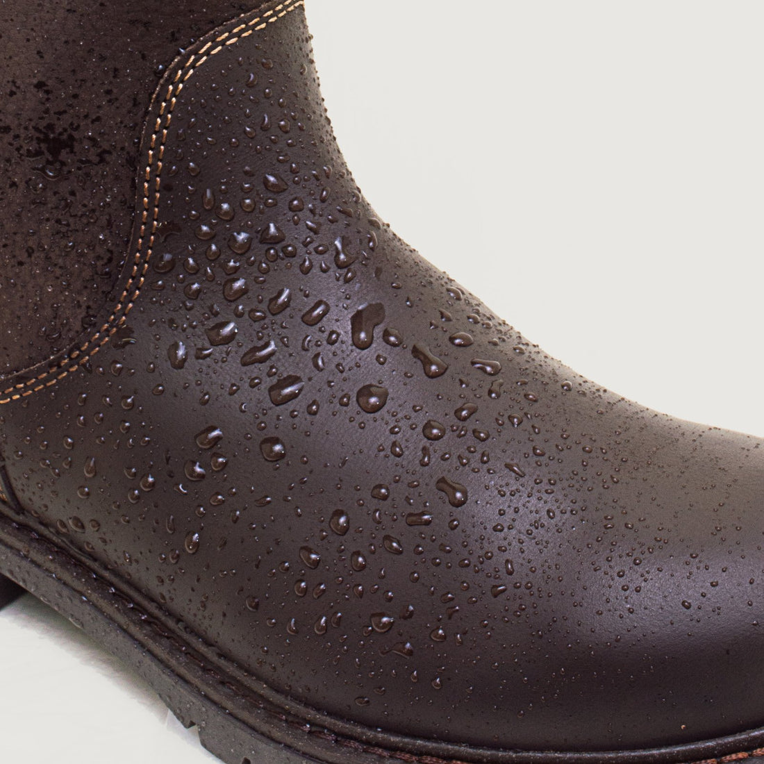 Bareback Quebec waterproof mid-calf boots in brown leather, close-up of water beading on the leather