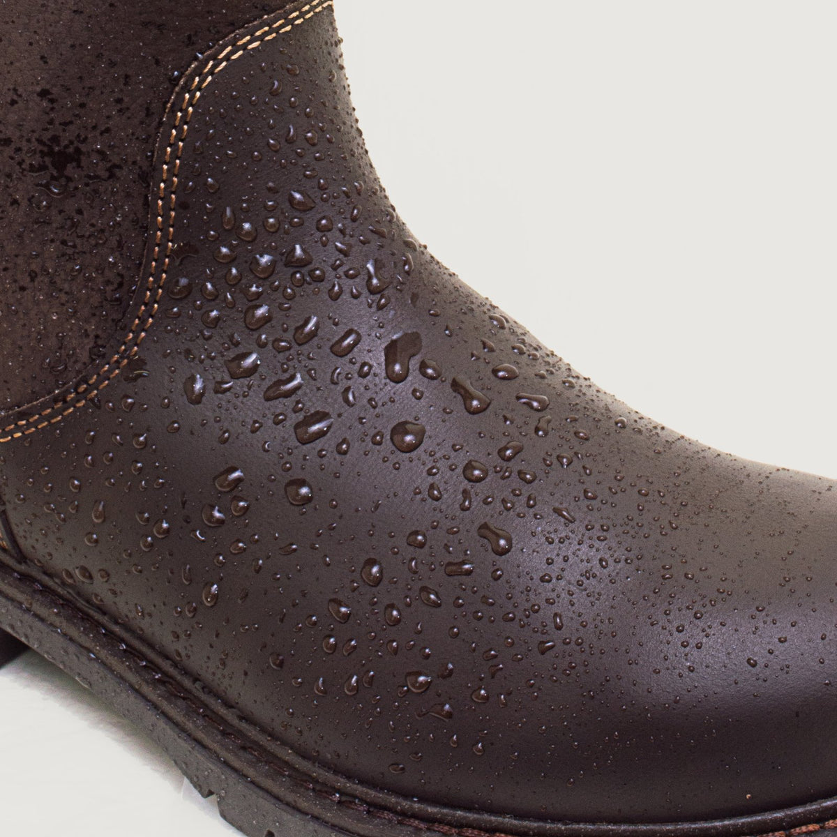 Bareback Quebec waterproof mid-calf boots in brown leather, close-up of water beading on the leather