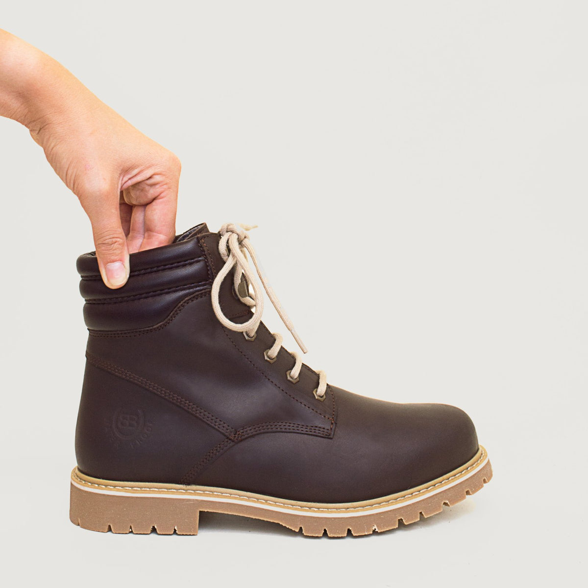 Bareback Rocky waterproof boots in brown, close-up of a hand pressing the padded collar