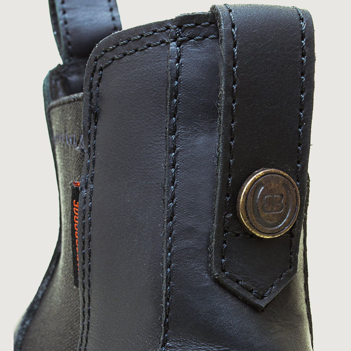 Bareback Vancouver Storm waterproof boots in black, close-up of the branded pull tab and elastic side panel
