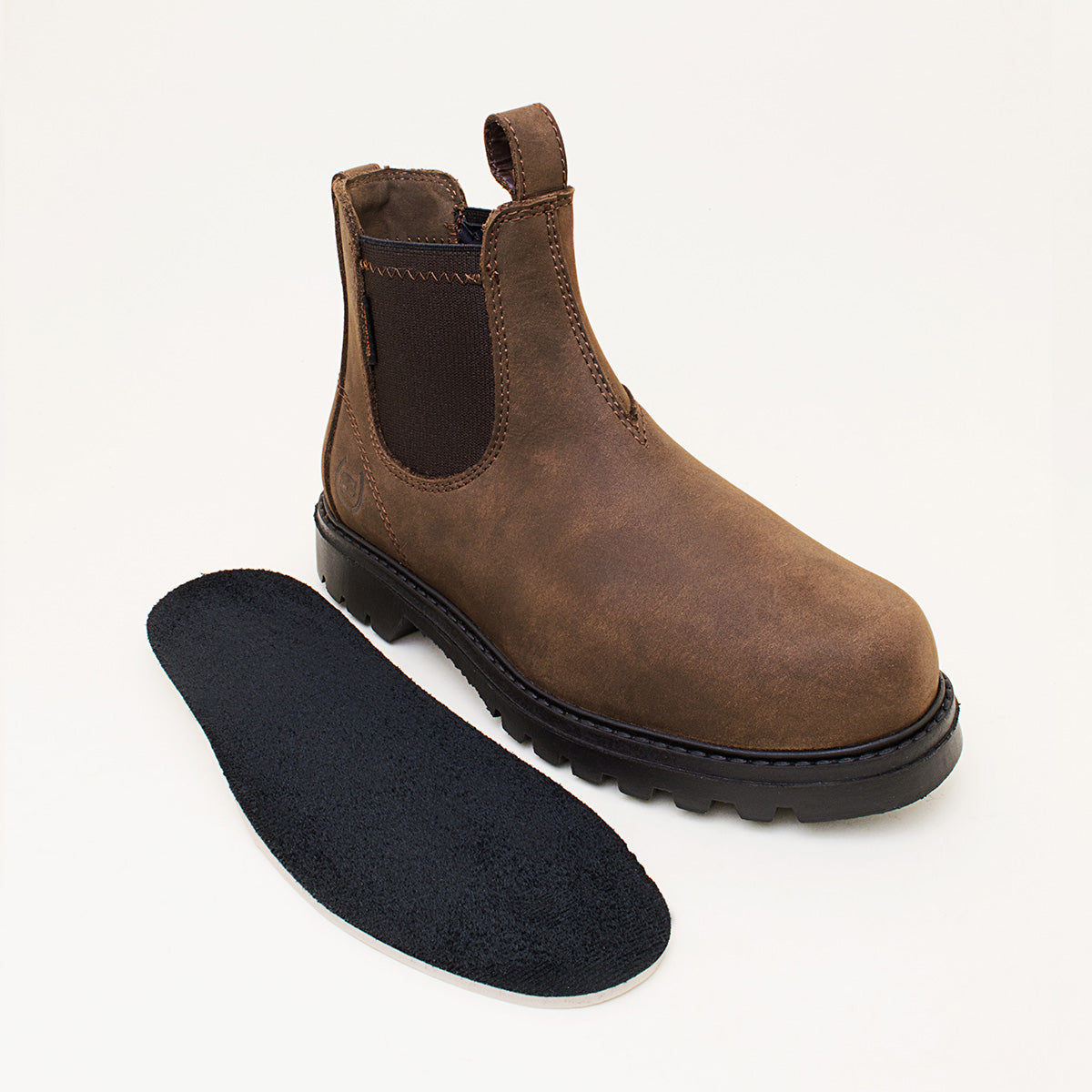 Bareback Vancouver Storm waterproof boots in brown, standing beside the removable suede-topped insole