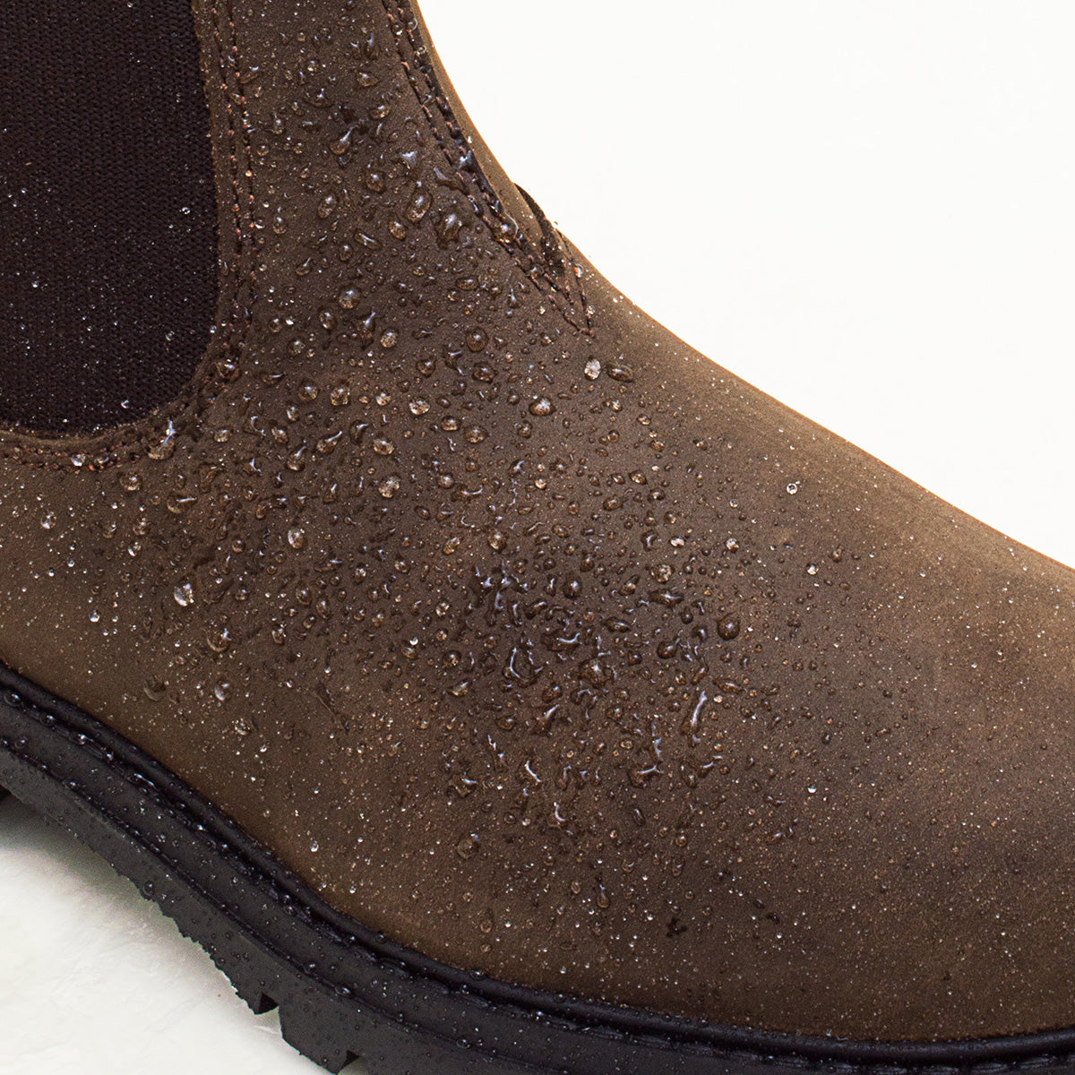 Bareback Vancouver Storm waterproof boots in brown, close-up of water droplets beading on the waterproof leather